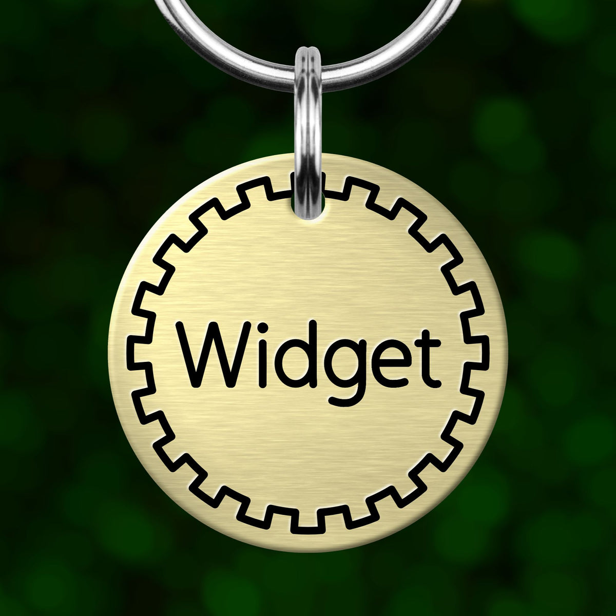 A round metal keychain tag with the word "Widget" printed on it, hanging from a metal hook.