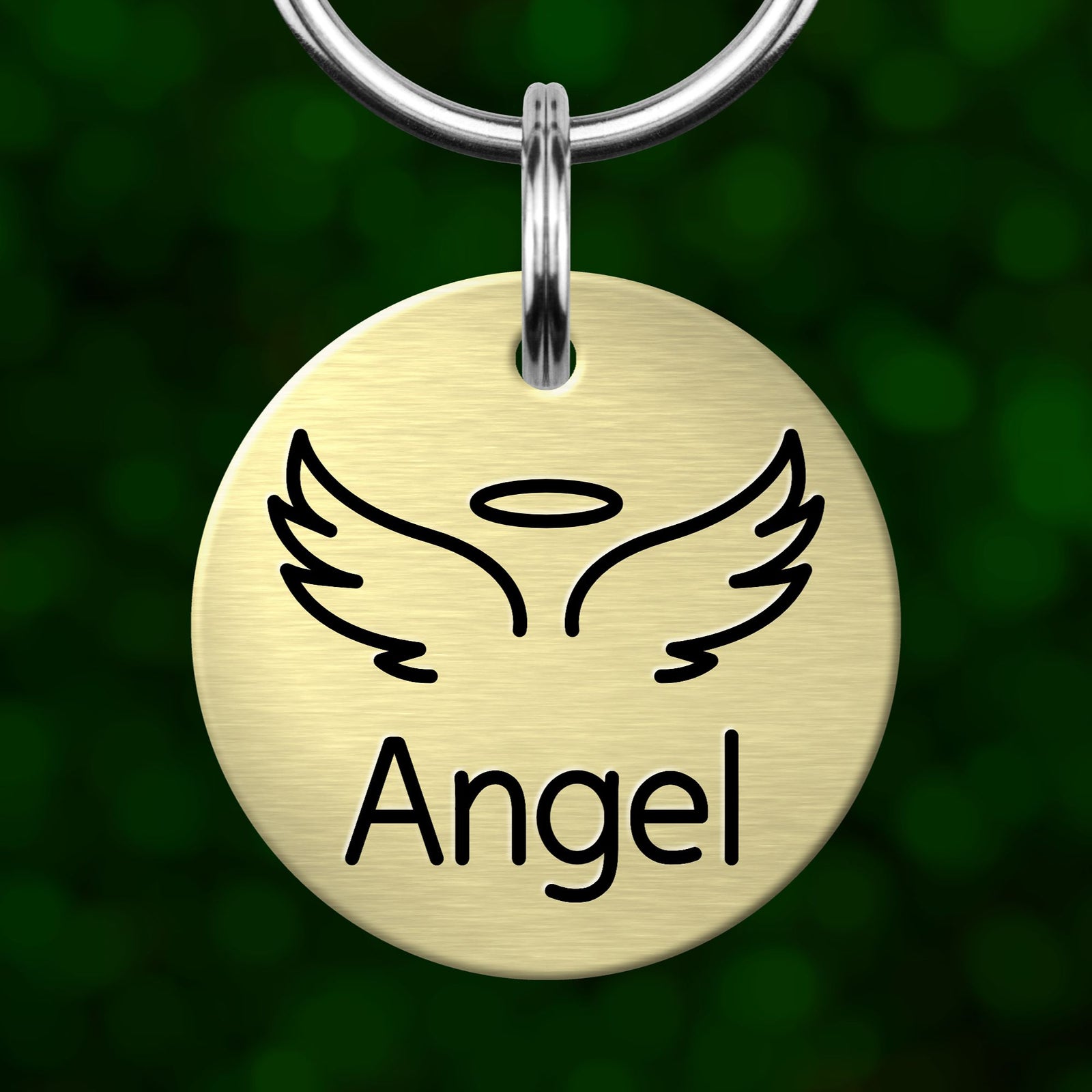 A round metal pet tag with a winged angel symbol and the word "Angel" printed on it.
