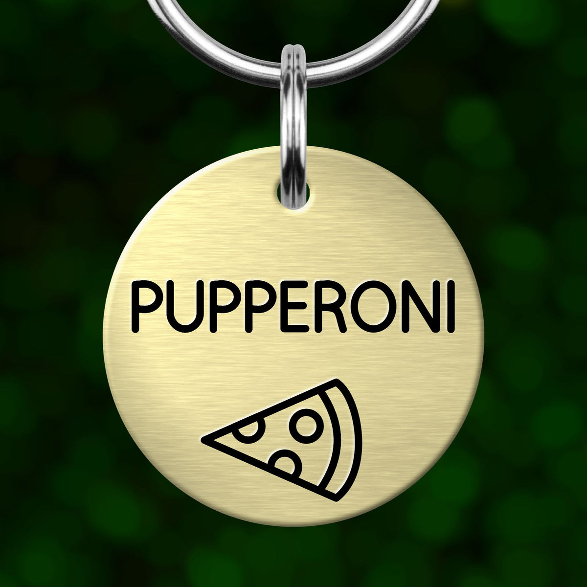 A round metal pet tag with the name "PUPPERONI" printed on it, along with a simple illustration of a slice of pizza.