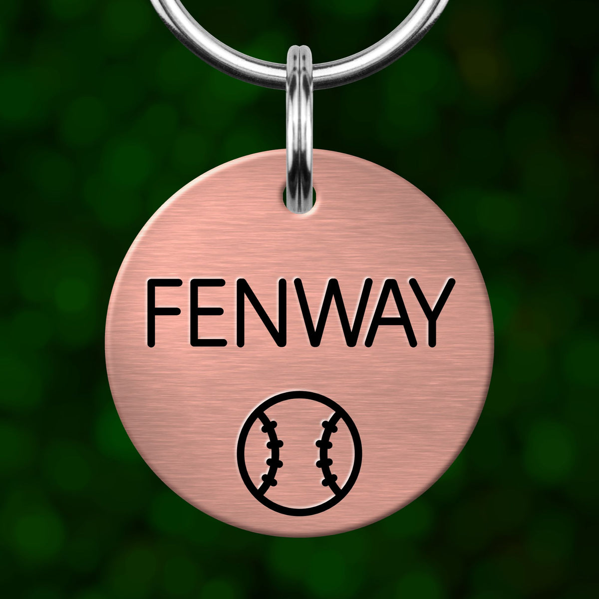 A round metal keychain tag with the text "FENWAY" and a baseball graphic.